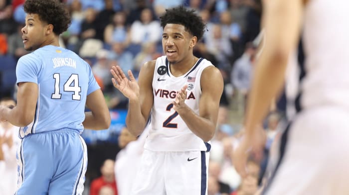 Reece Beekman claps his hands during the Virginia men's basketball game against North Carolina in the quarterfinals of the ACC Tournament at Greensboro Coliseum.